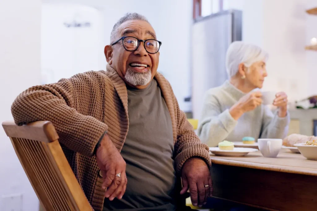 Senior man dining with friends
